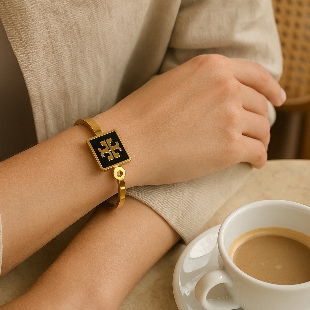Gold and Black Wearable Tech Bracelet